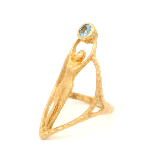 14k yellow organic ring with bezel set 0.20ct aquamarine. Shown from the side.