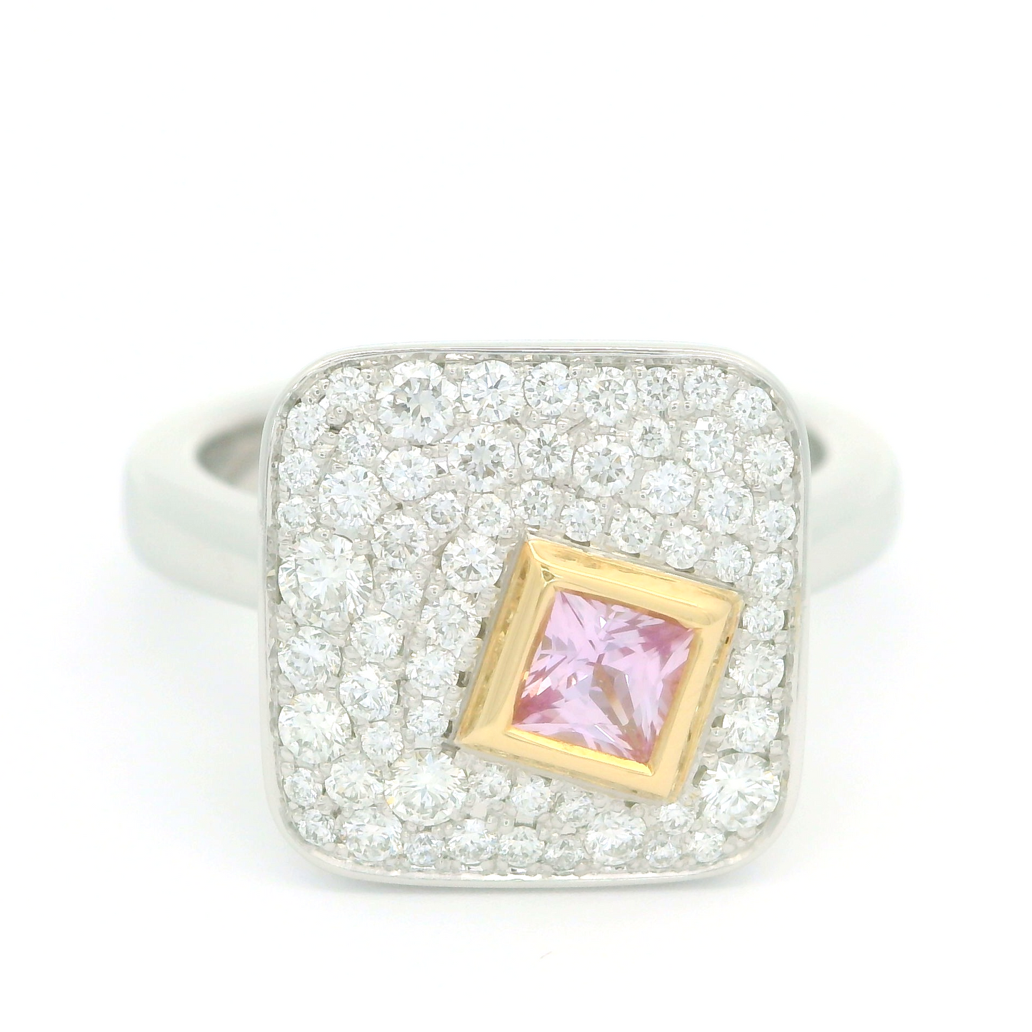 Plat and 18k yellow ring with bezel set 0.25ct pink princess cut sapphire surrounded by pave set diamonds.