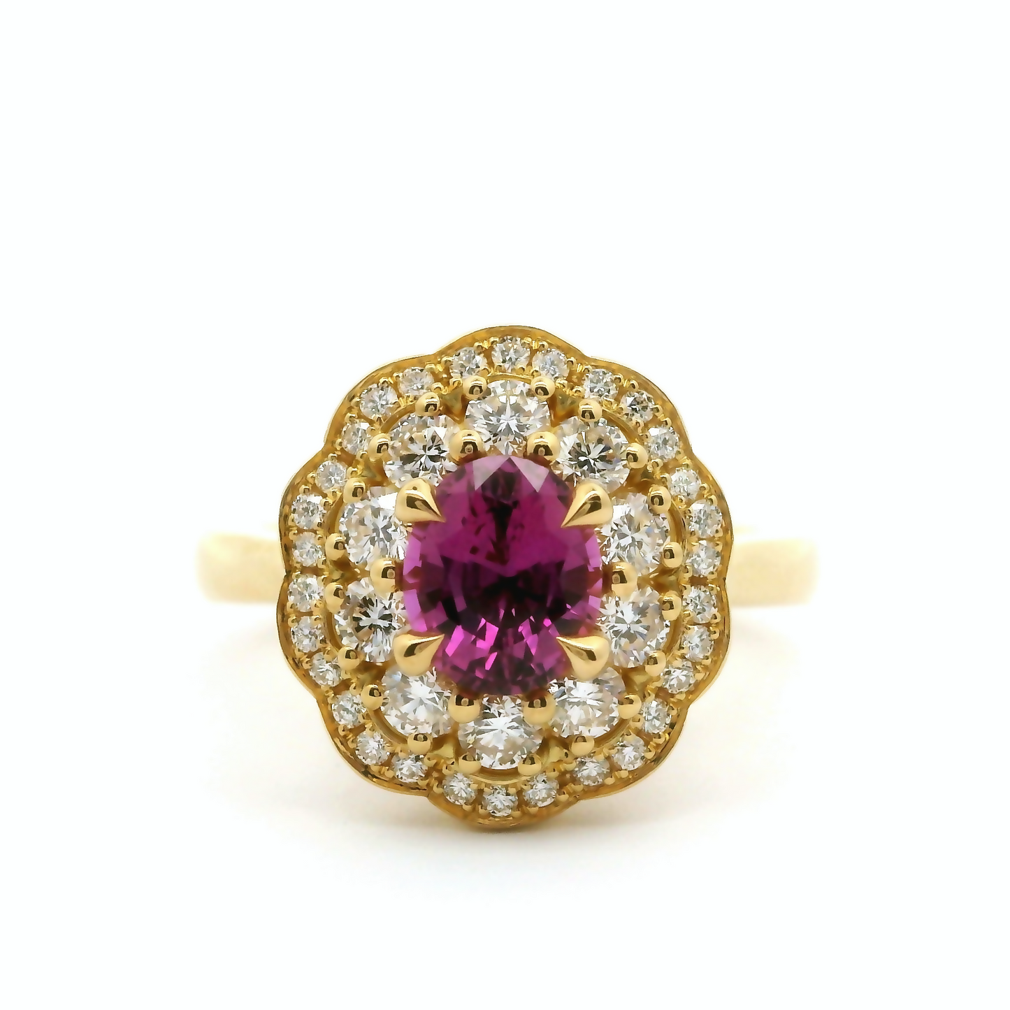 18k yellow ring with 1.06ct pink sapphire accented with diamonds.