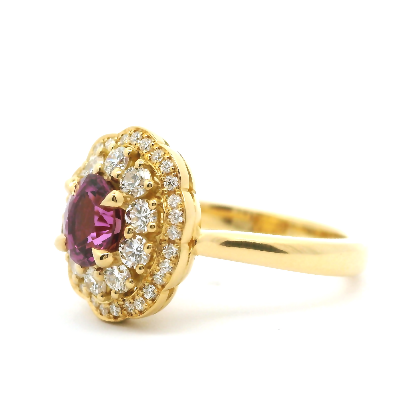 18k yellow ring with 1.06ct pink sapphire accented with diamonds. Shown from the side.