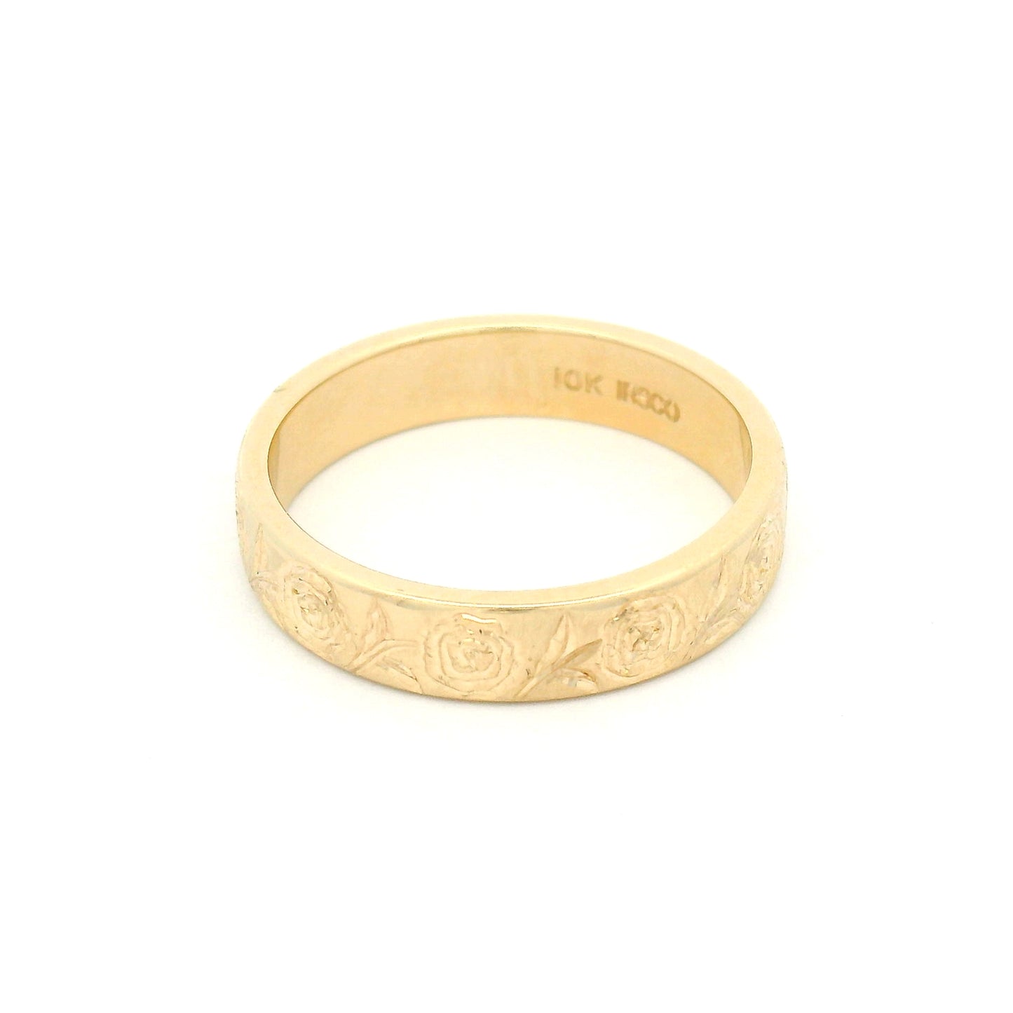 10K yellow gold 4mm soft domed wedding band with hand-engraved peony floral design covering two-thirds of the band.