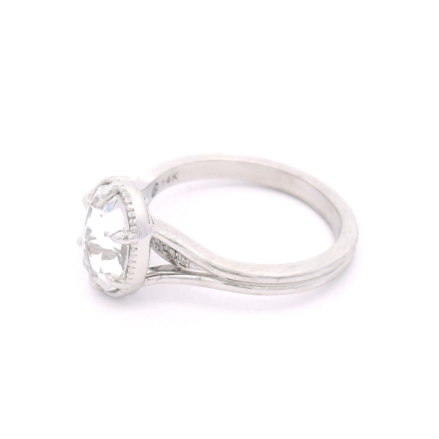 14K white gold engagement ring featuring a 2.01ct lab-grown rose-cut oval white sapphire with hidden bead-set lab-grown diamond accents in the gallery.