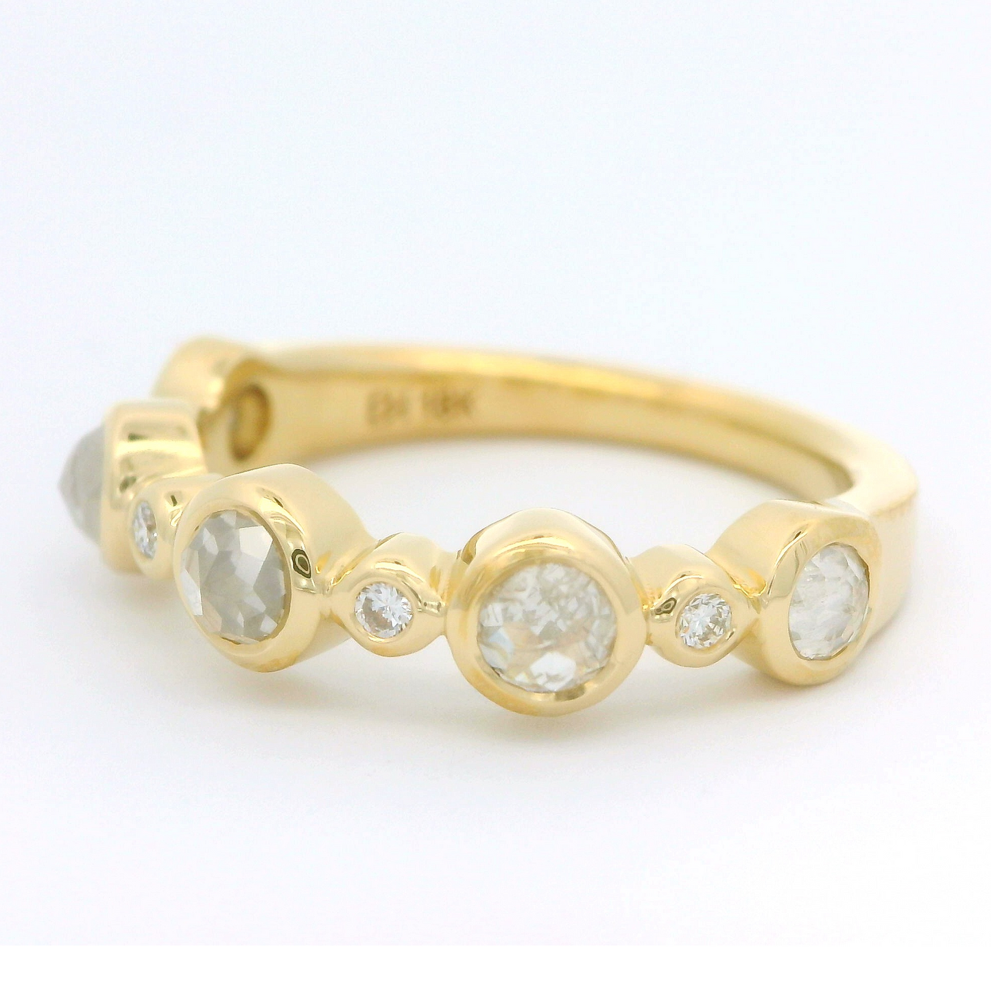 18k yellow band set with 0.90cts total weight of Icy rose cut diamonds and brilliant cut diamonds. Shown from the side.