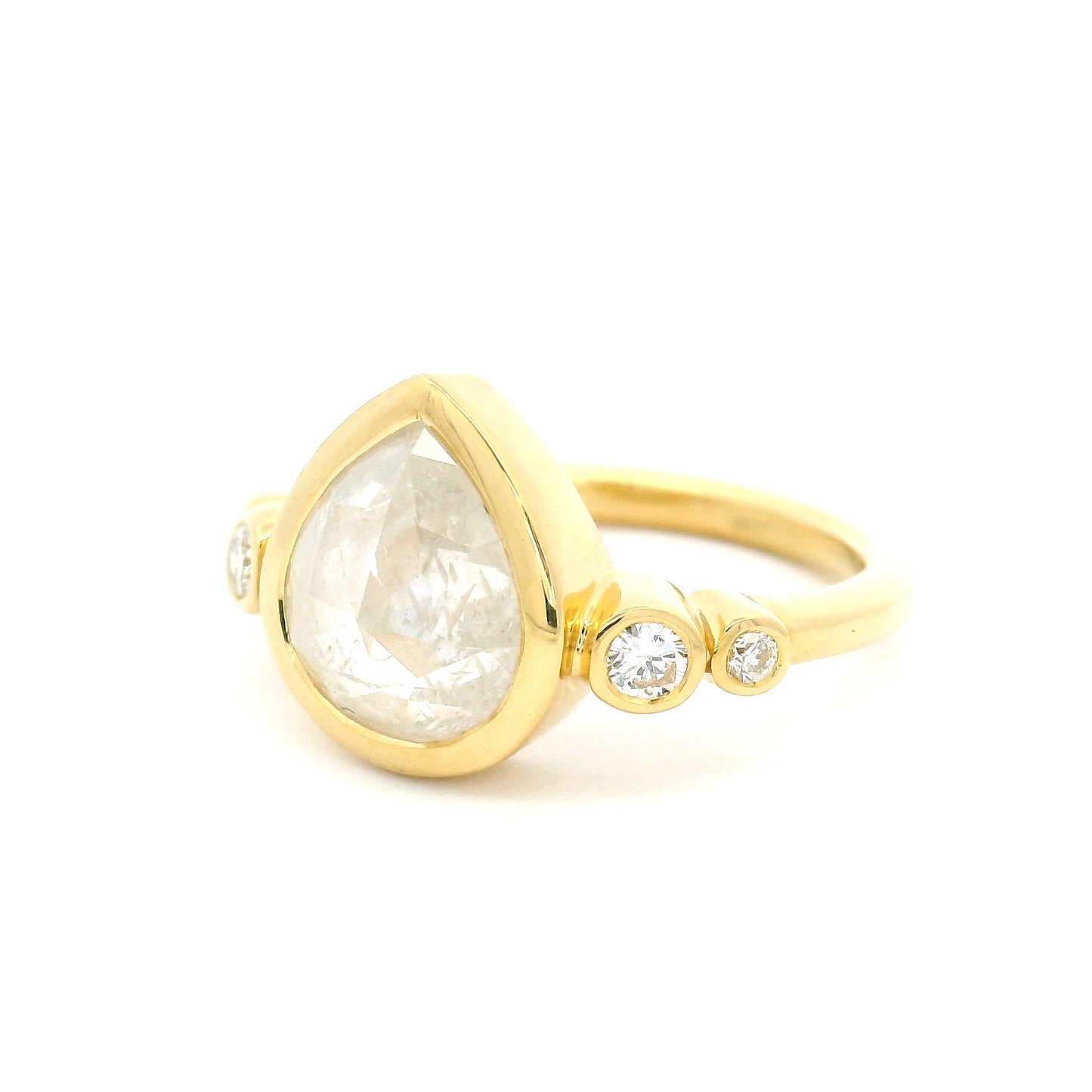 18k yellow ring 2.61ct pear rose cut diamond and accent diamonds. Shown from an angle.