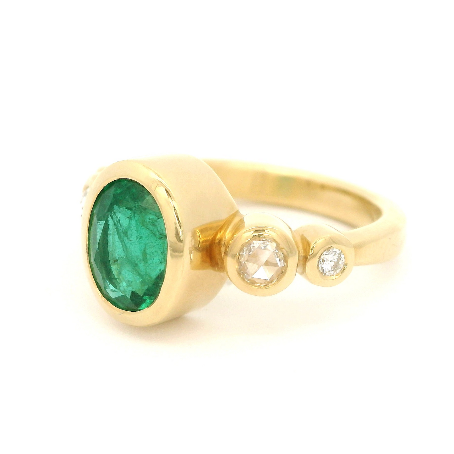 18k yellow gold ring with 1.70ct natural oval emerald and accent diamonds. Shown from the side.