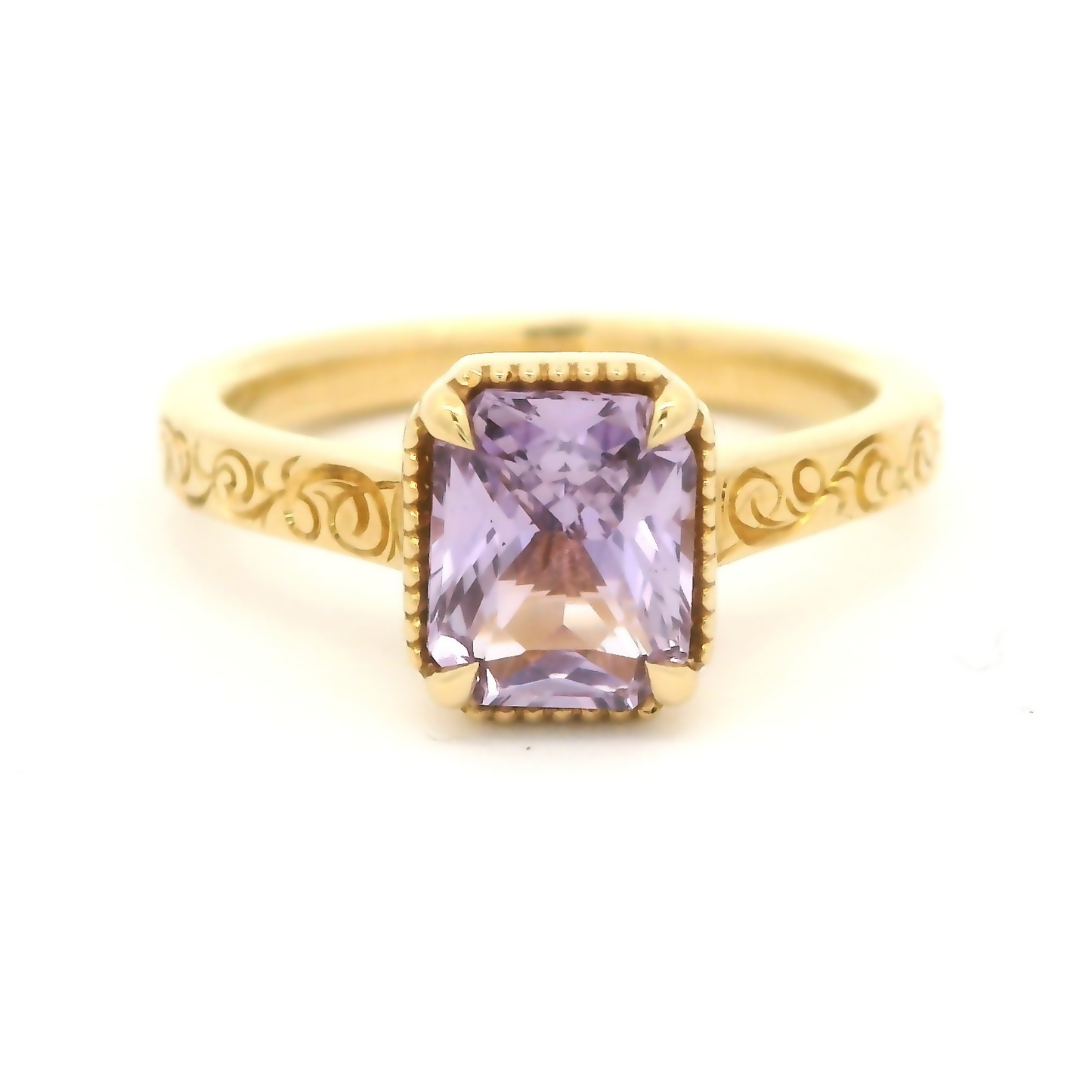 18k yellow gold ring with 1.63ct lavender sapphire and hand engraving.
