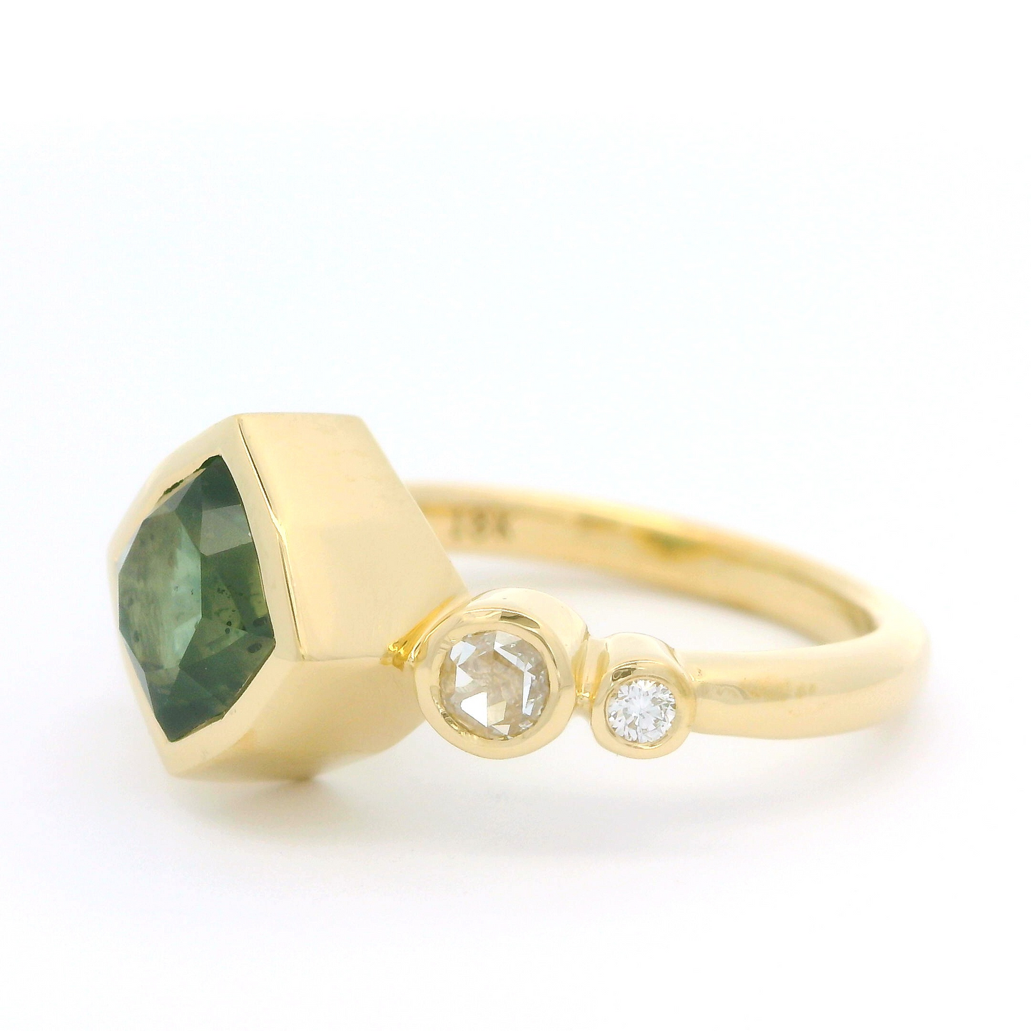 18k yellow ring 2.55ct Montana sapphire and accent diamonds. Shown from a angle.