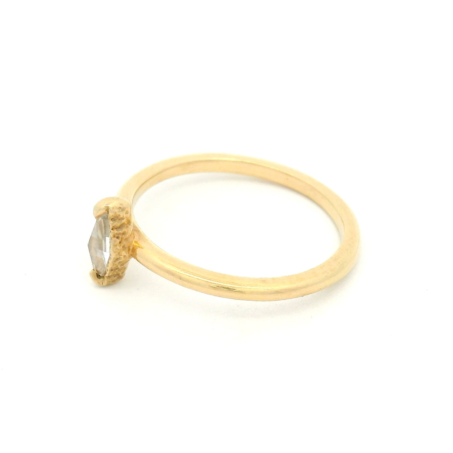 14K yellow gold solitaire ring featuring a 0.15ct diamond-shaped rose-cut moissanite, organic textured gallery, and polished 1.7mm soft domed band.