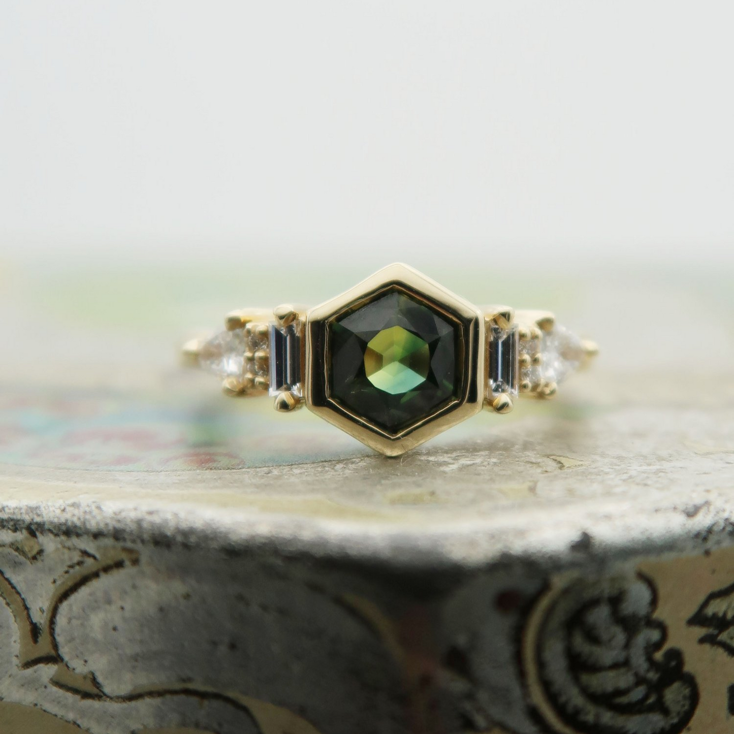 14K 0.88ct Australian green sapphire lab diamond accent engagement ring. Displayed on a tile, focusing on the centre gem.