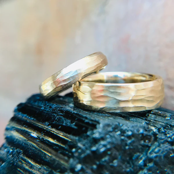14k Yellow Hand Carved Textured Wedding Band. Shown with a matching narrower band.