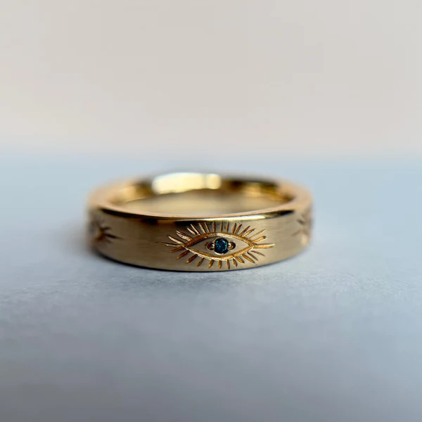 14k Yellow Egyptian eye teal diamonds band.