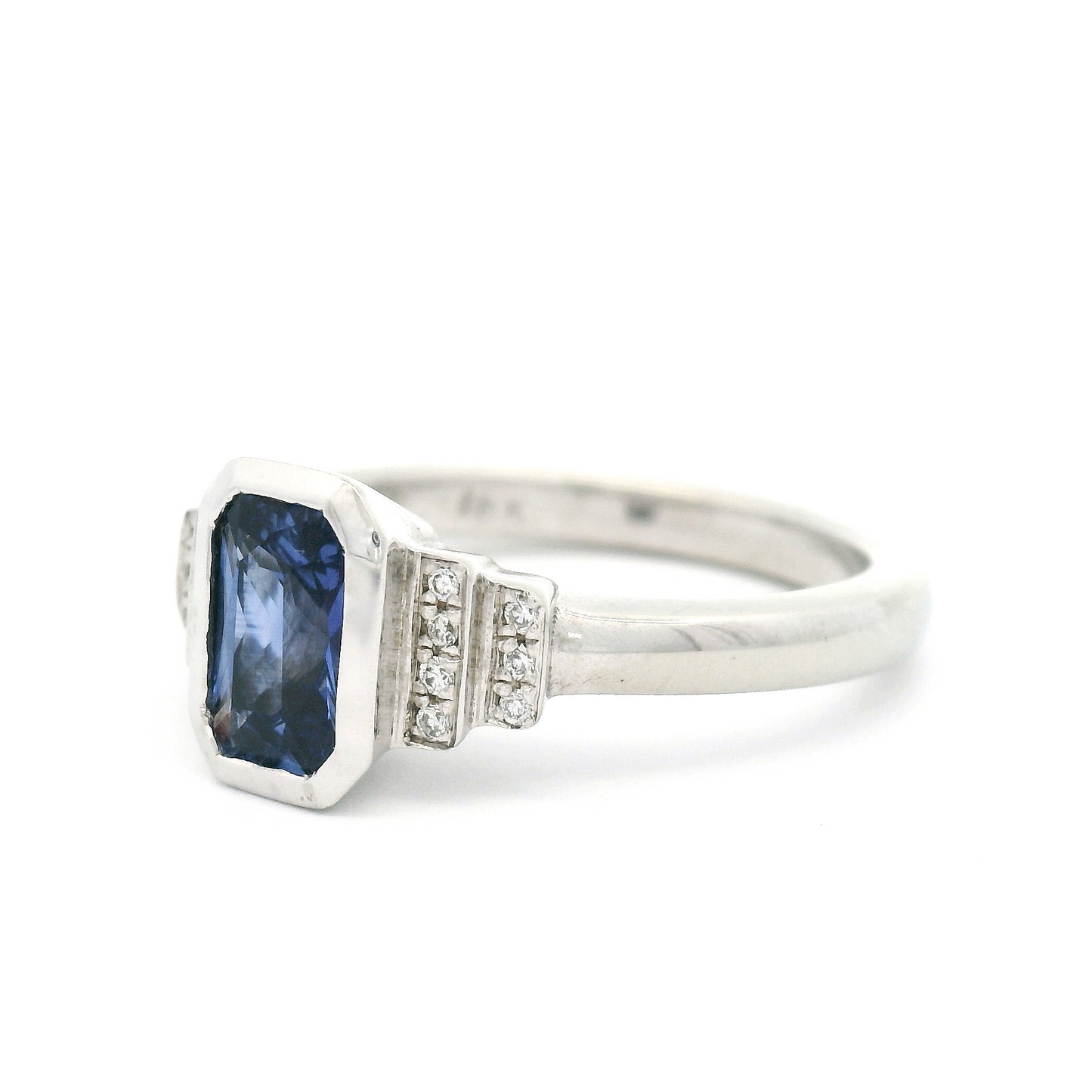 18k White Engagement Ring with 0.77ct Vibrant Blue Emerald Cut Sapphire and Accent Diamonds
