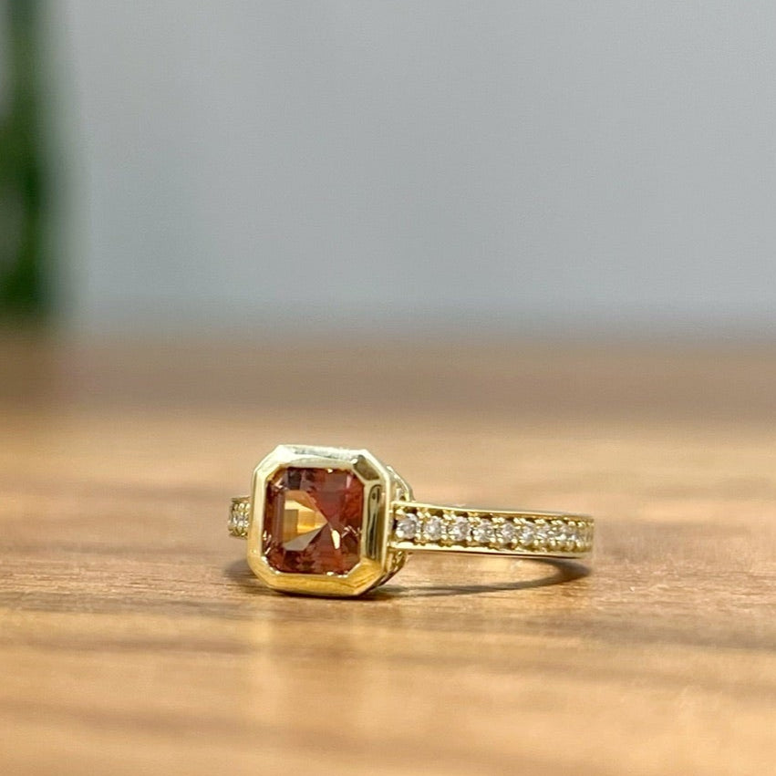 18k Yellow Bezel Set Ring with 0.86ct Orange Sapphire and Accent Diamonds