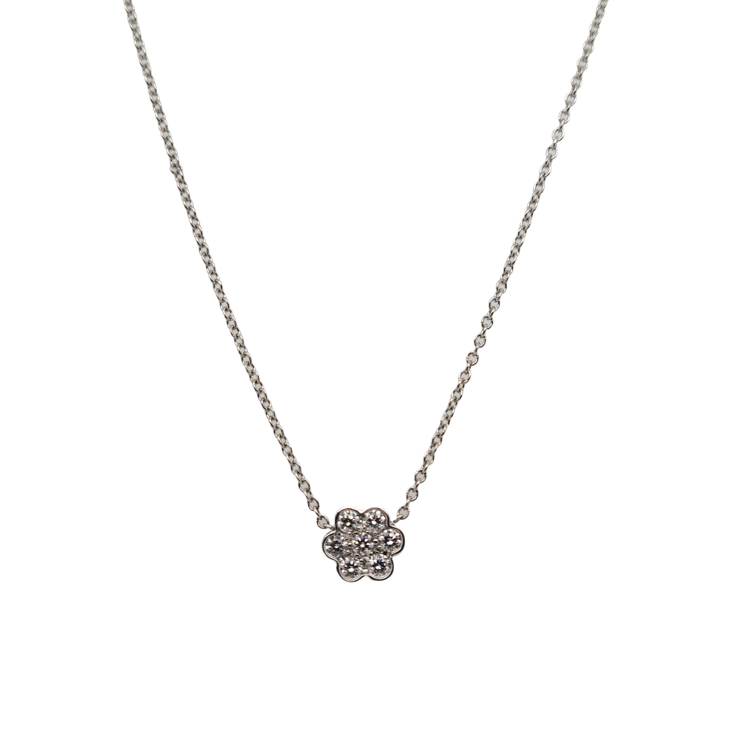 Platinum necklace with 0.21cts of VS1–VS2, E–F round brilliant diamonds in a floral pattern. Elegant and timeless, perfect for any occasion.