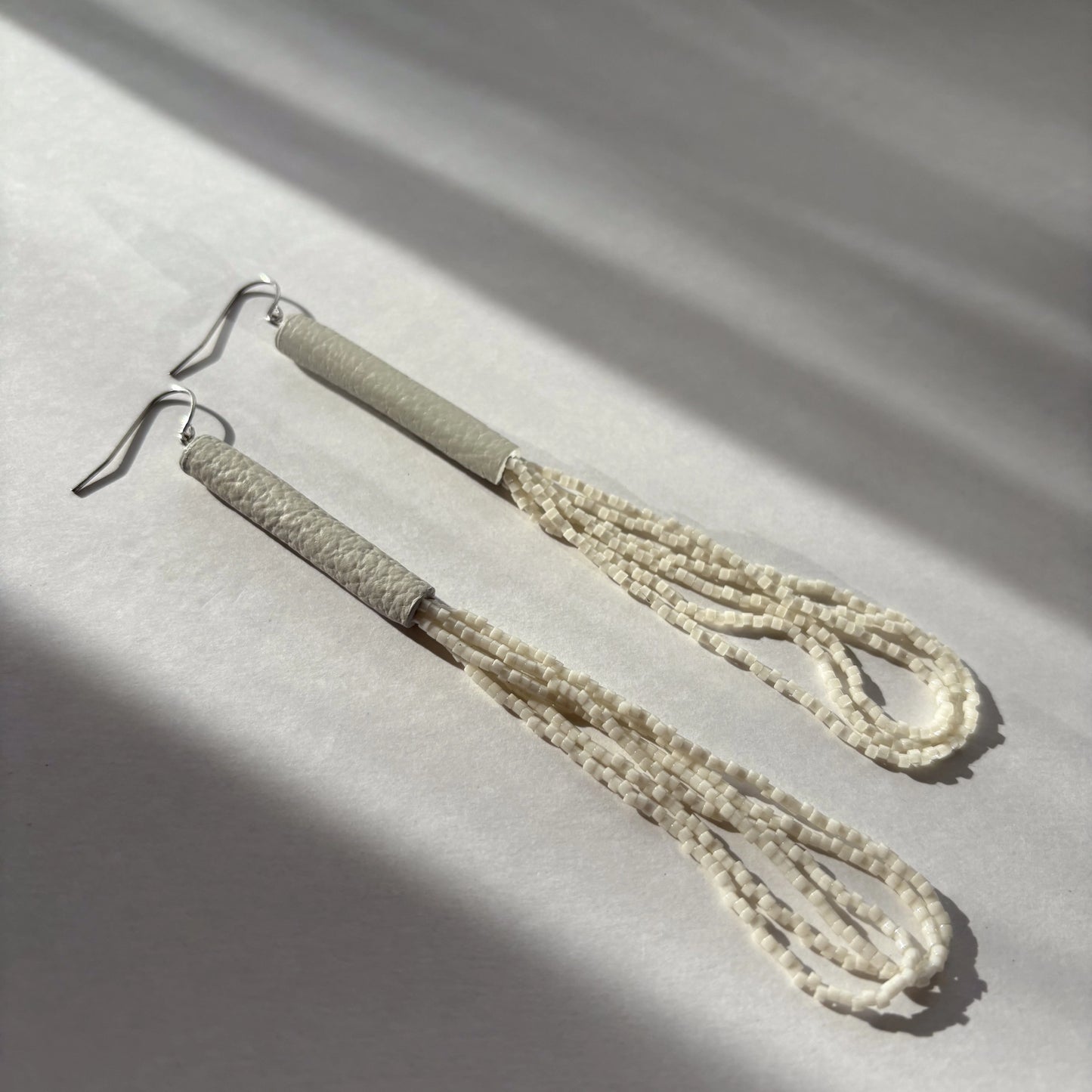 Palea Ivory Beaded Leather Earrings