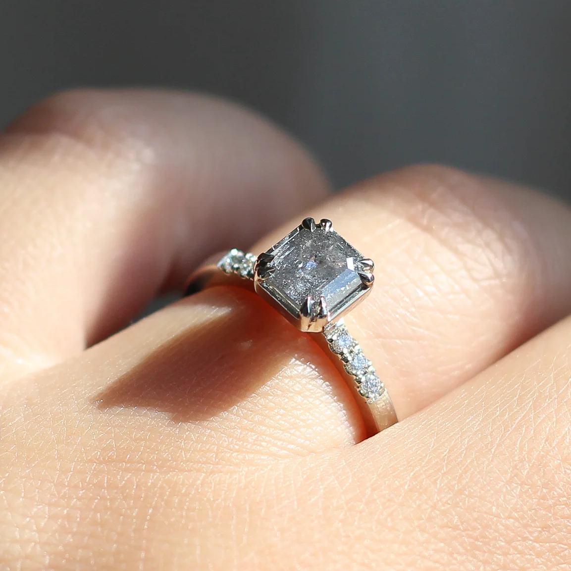 14k White Engagement Ring with 1.18ct Salt & Pepper Diamond and Accent Diamonds. Shown on a hand.