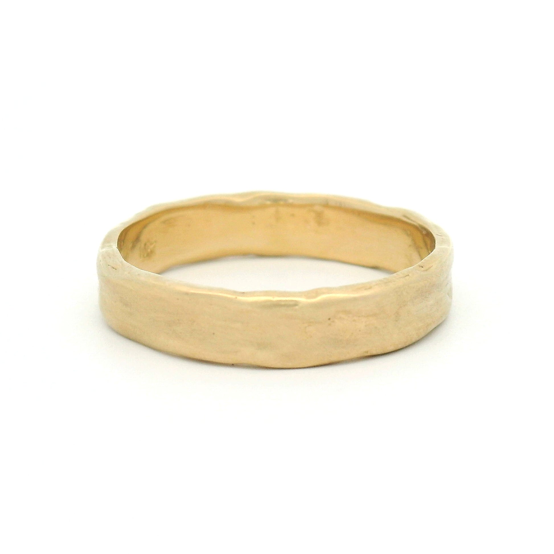 10K yellow gold 4.5mm organic wedding band featuring a smooth handcrafted texture and softly sculpted profile.