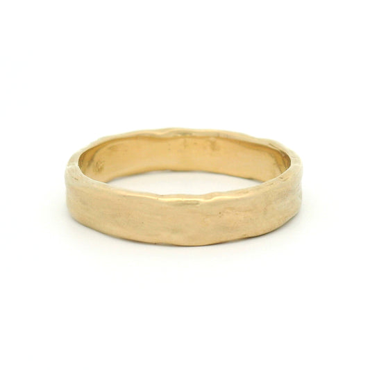 10K yellow gold 4.5mm organic wedding band featuring a smooth handcrafted texture and softly sculpted profile.