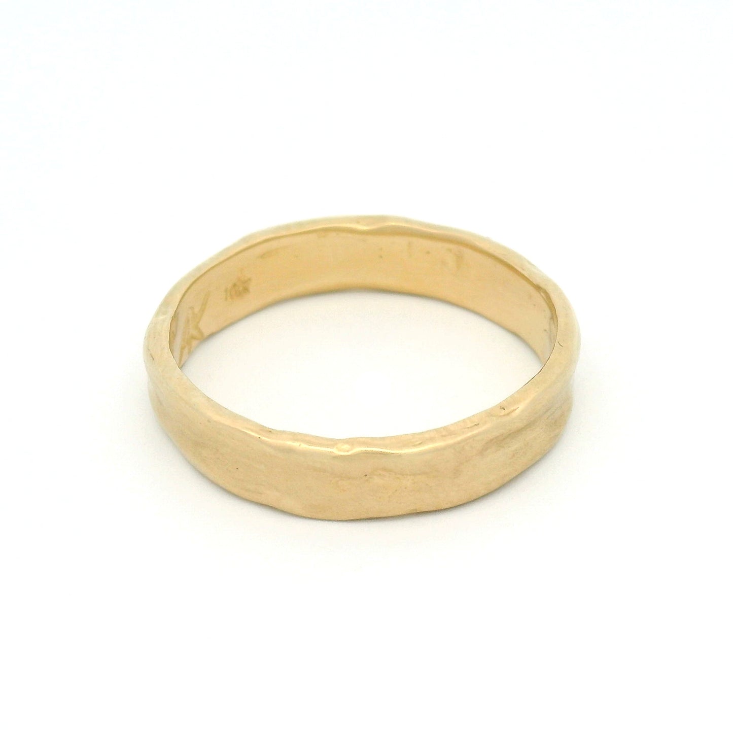 10K yellow gold 4.5mm organic wedding band featuring a smooth handcrafted texture and softly sculpted profile.