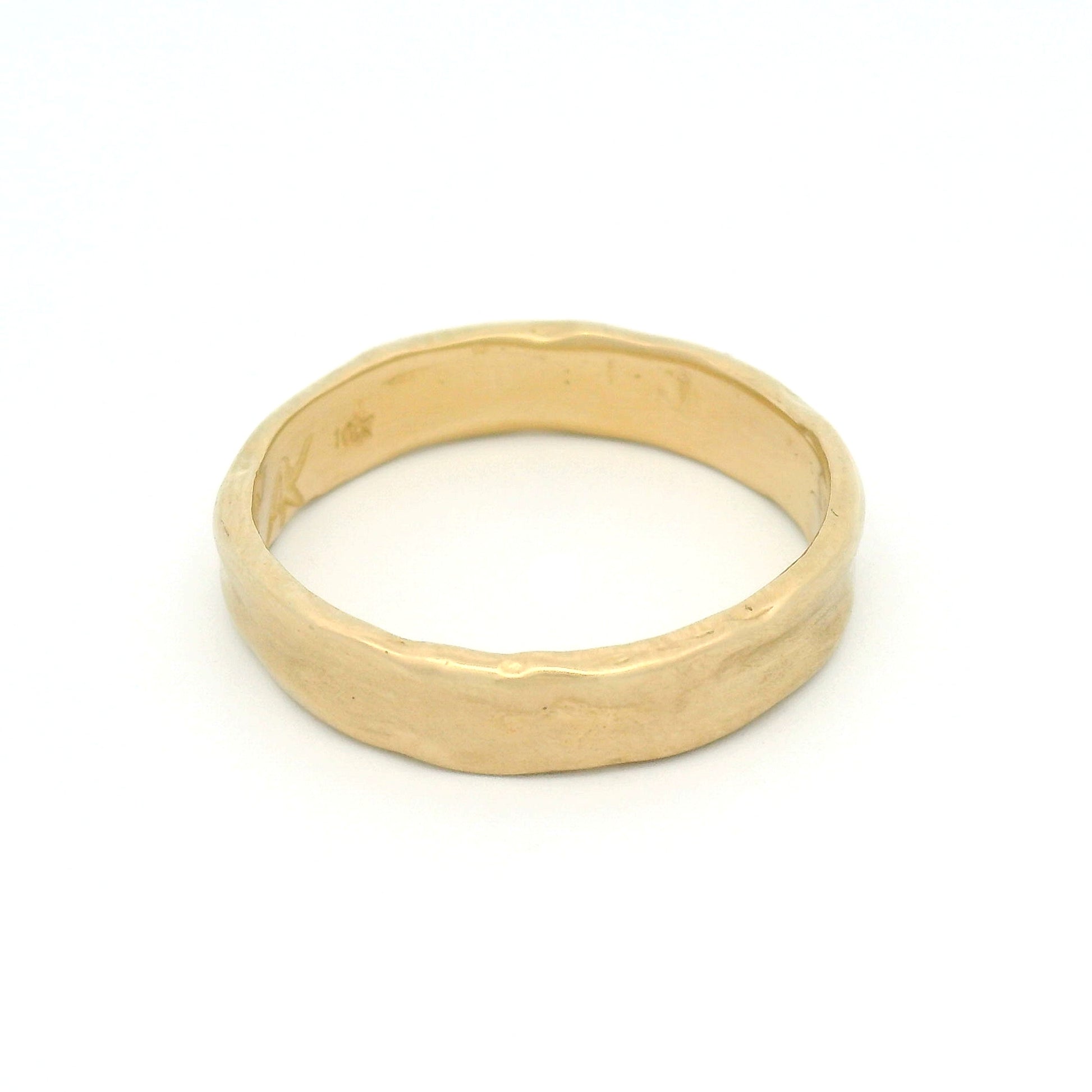 10K yellow gold 4.5mm organic wedding band featuring a smooth handcrafted texture and softly sculpted profile.