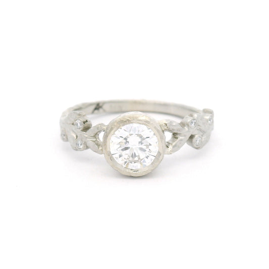 14K white gold textured leaf engagement ring with a 0.74ct lab-grown round brilliant-cut diamond and six bead-set lab-grown diamonds among the leaves.