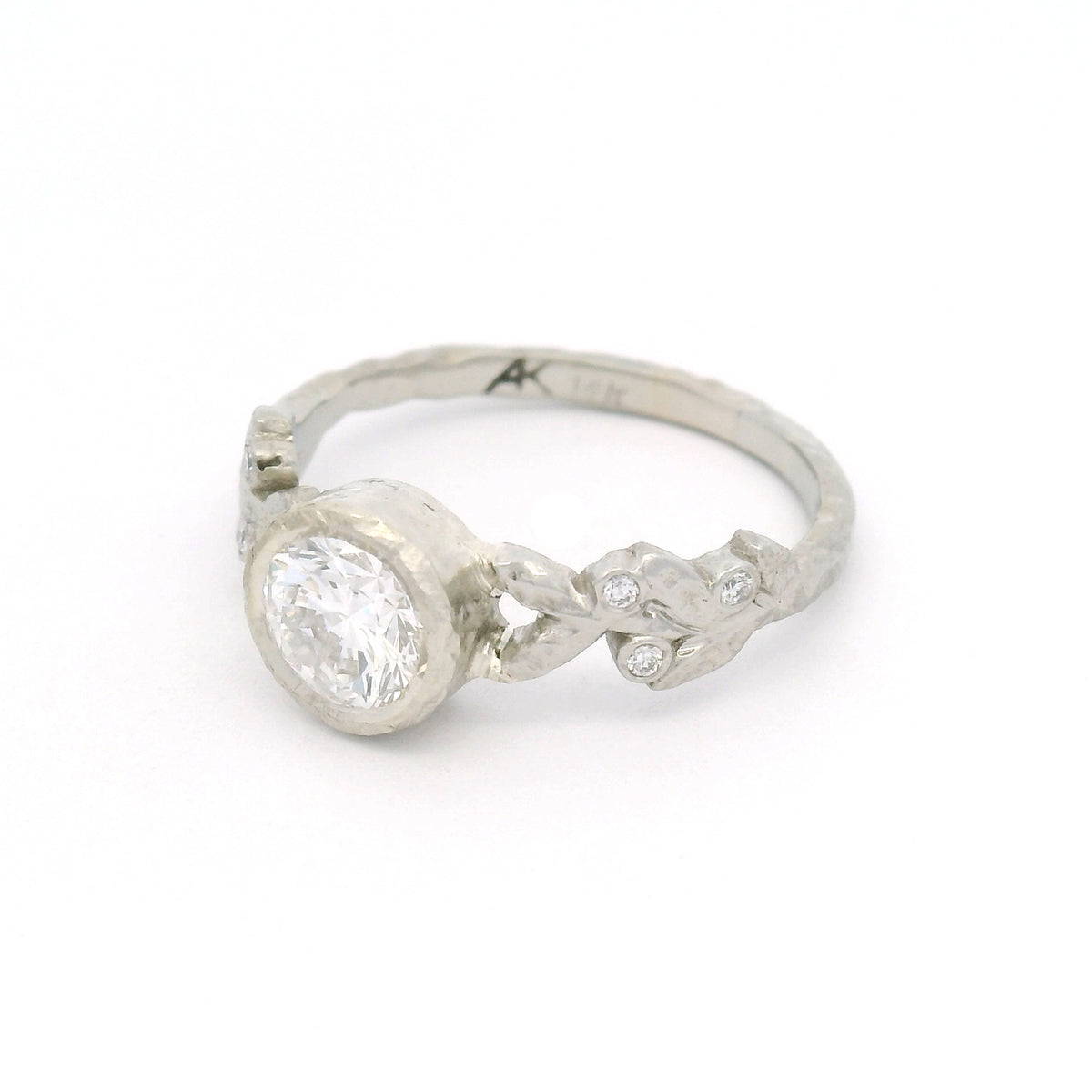 14K white gold textured leaf engagement ring with a 0.74ct lab-grown round brilliant-cut diamond and six bead-set lab-grown diamonds among the leaves.