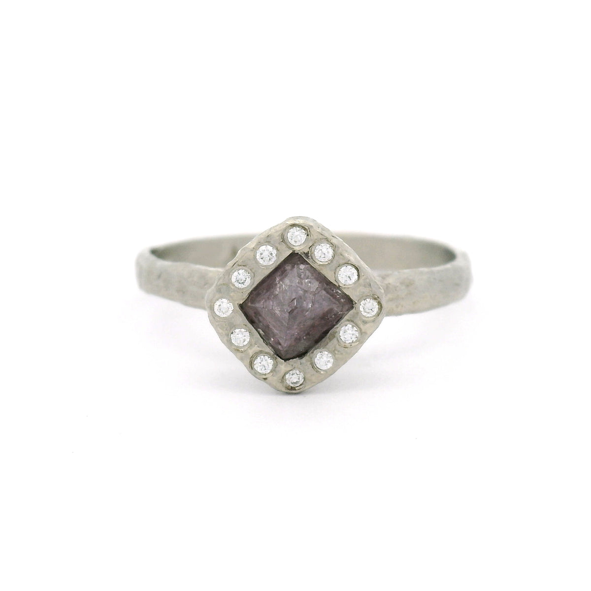 14K white gold organic textured engagement ring with a natural 0.74ct rough octahedron diamond with faint purple colour, surrounded by 12 natural round brilliant-cut diamonds.