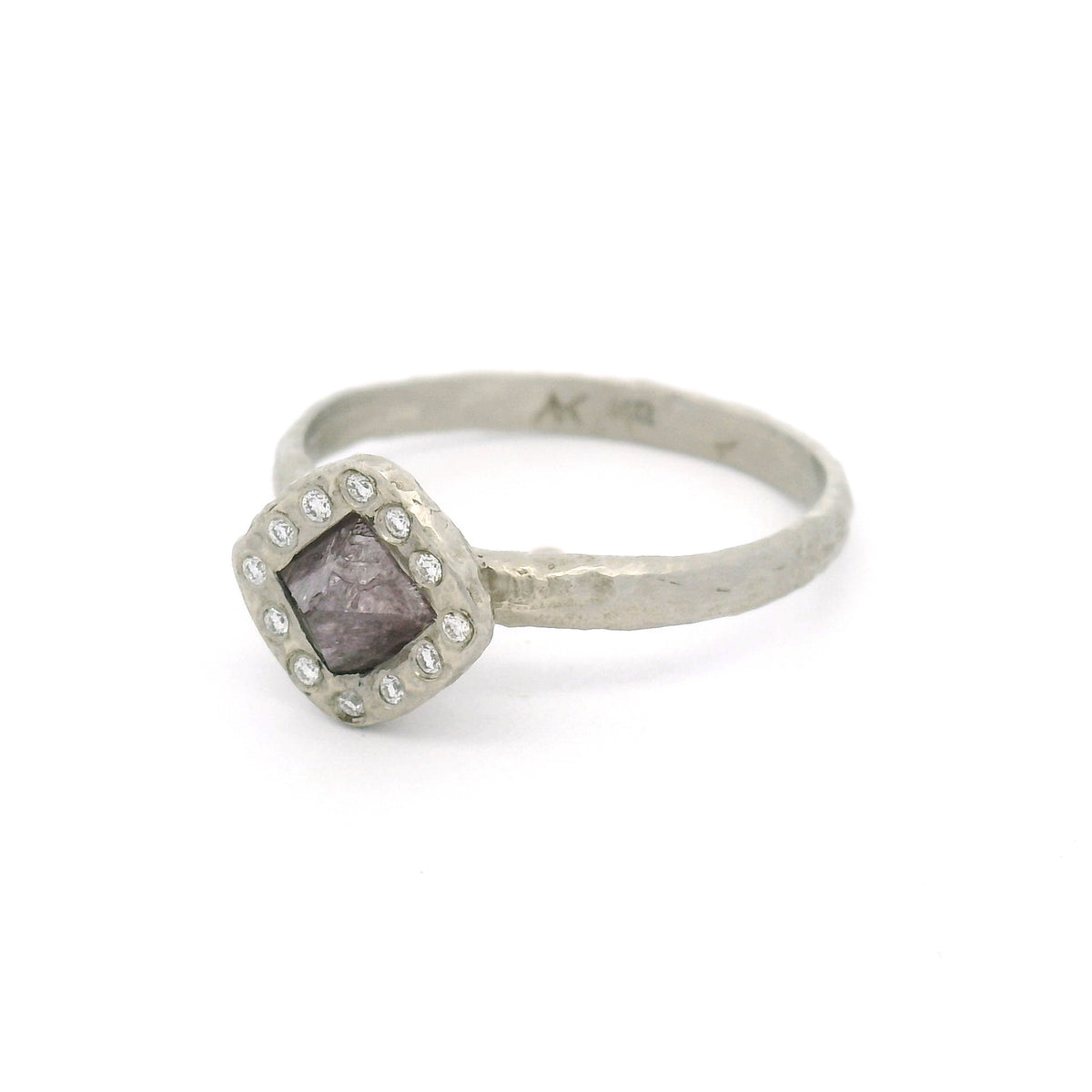 14K white gold organic textured engagement ring with a natural 0.74ct rough octahedron diamond with faint purple colour, surrounded by 12 natural round brilliant-cut diamonds.