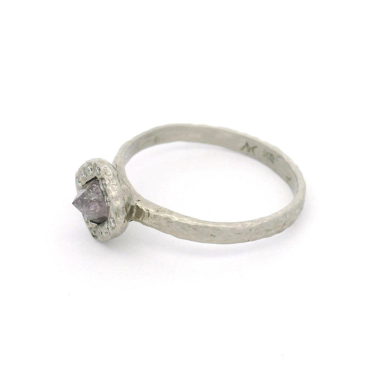 14K white gold organic textured engagement ring with a natural 0.74ct rough octahedron diamond with faint purple colour, surrounded by 12 natural round brilliant-cut diamonds.