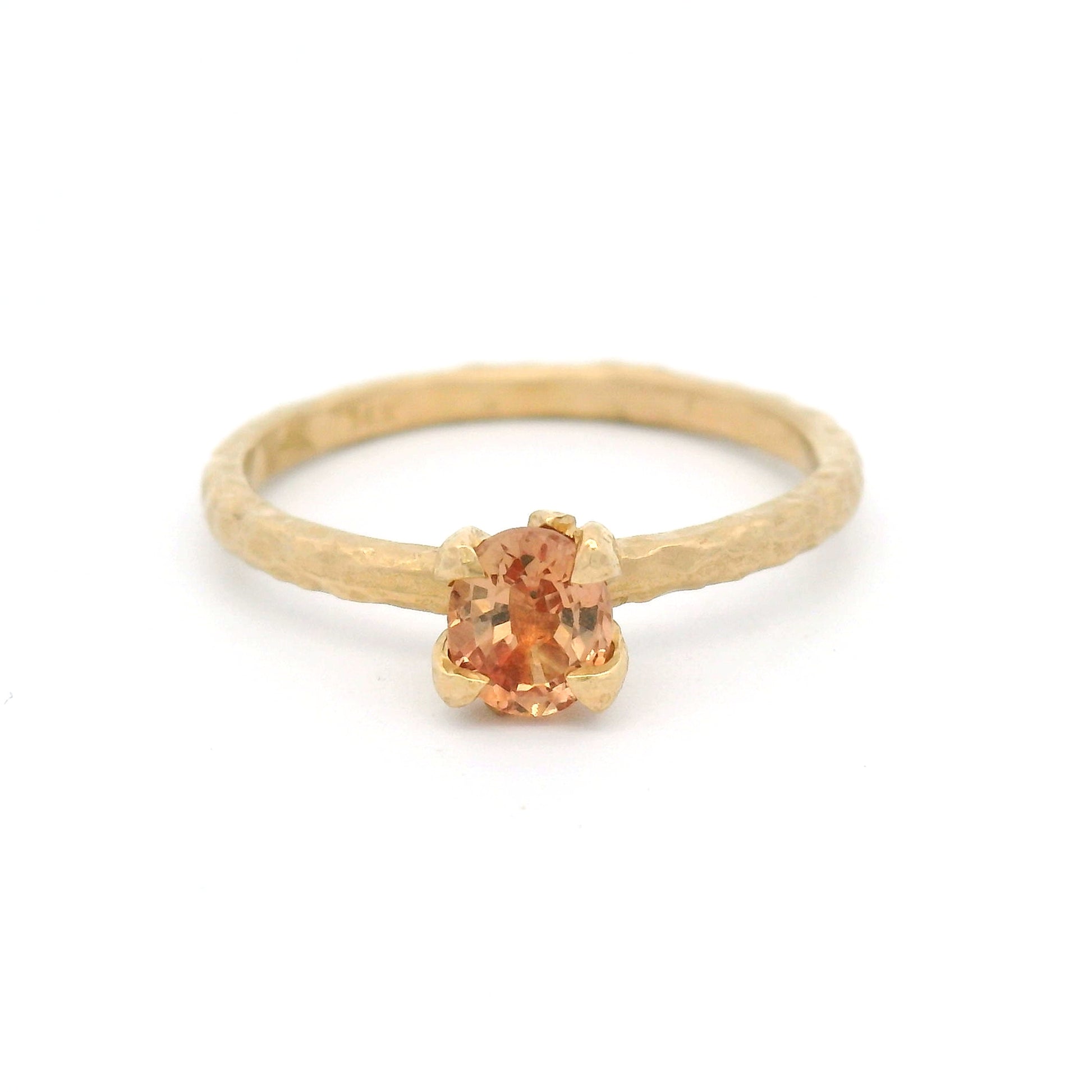 14K yellow gold organic solitaire engagement ring with claw-set natural 0.46ct oval peach sapphire and sculptural organic design.