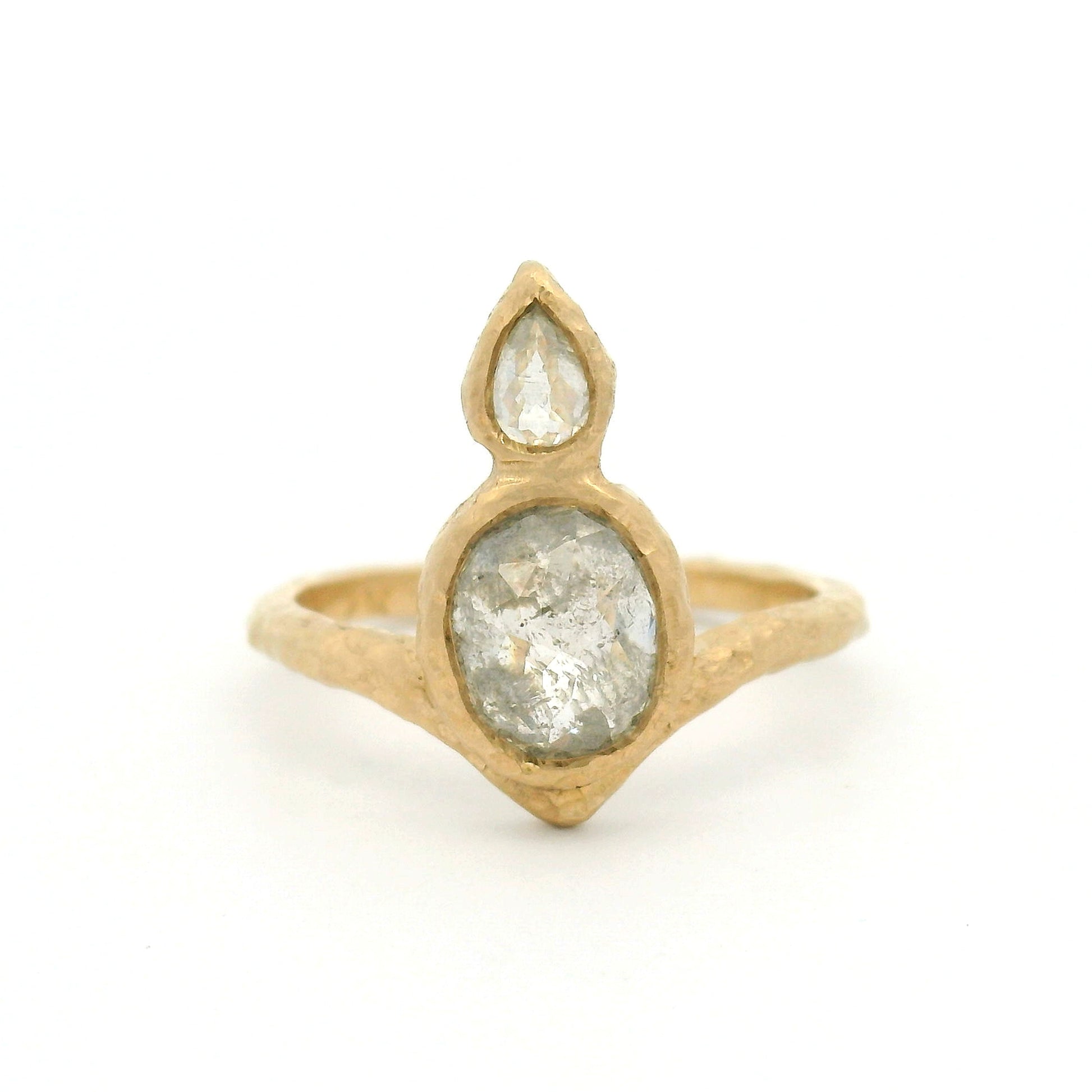 14K yellow gold organic Chevron ring with bezel-set 1.37ct oval rose-cut diamond and 0.15ct pear-shaped rose-cut diamond arranged vertically down the finger.