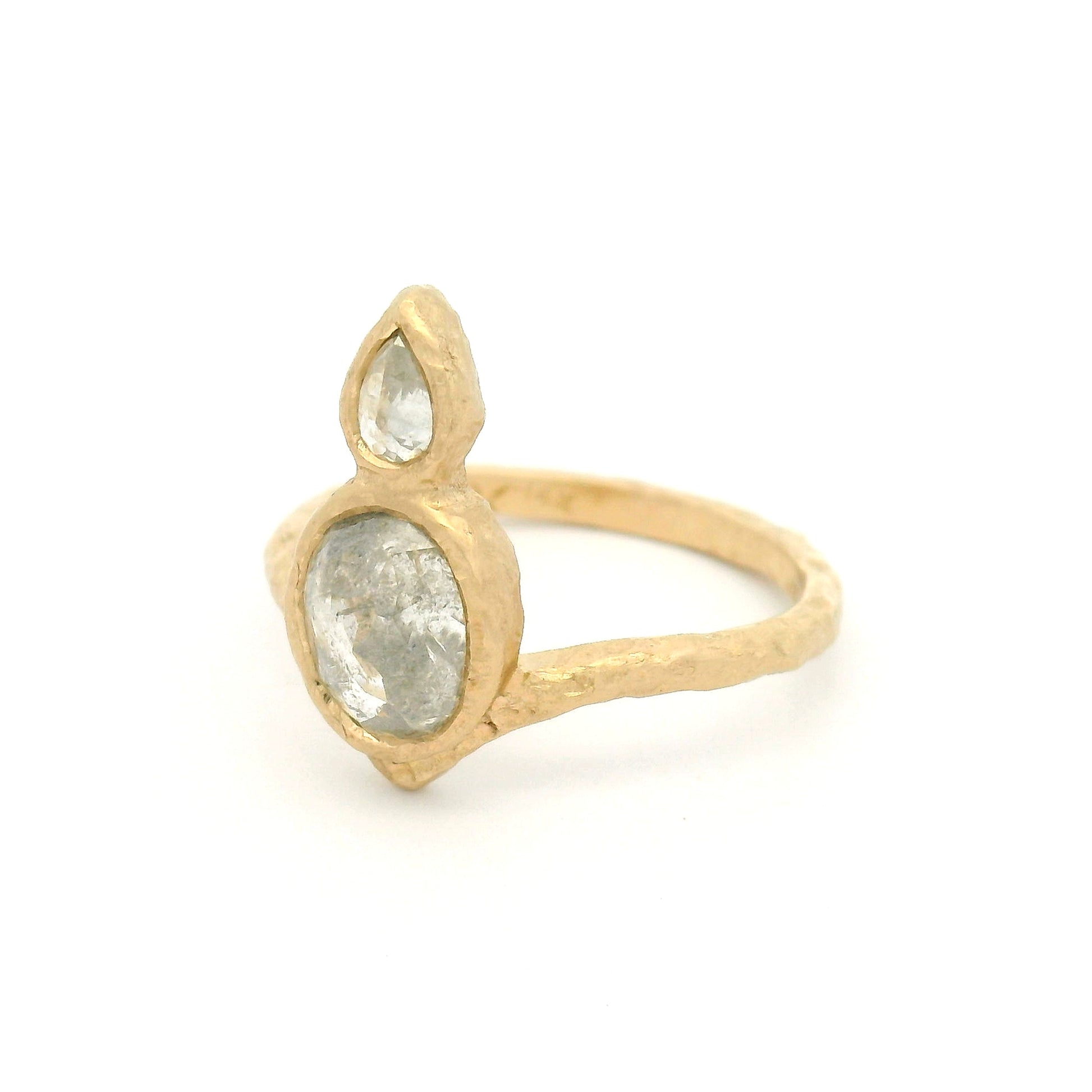 14K yellow gold organic Chevron ring with bezel-set 1.37ct oval rose-cut diamond and 0.15ct pear-shaped rose-cut diamond arranged vertically down the finger.