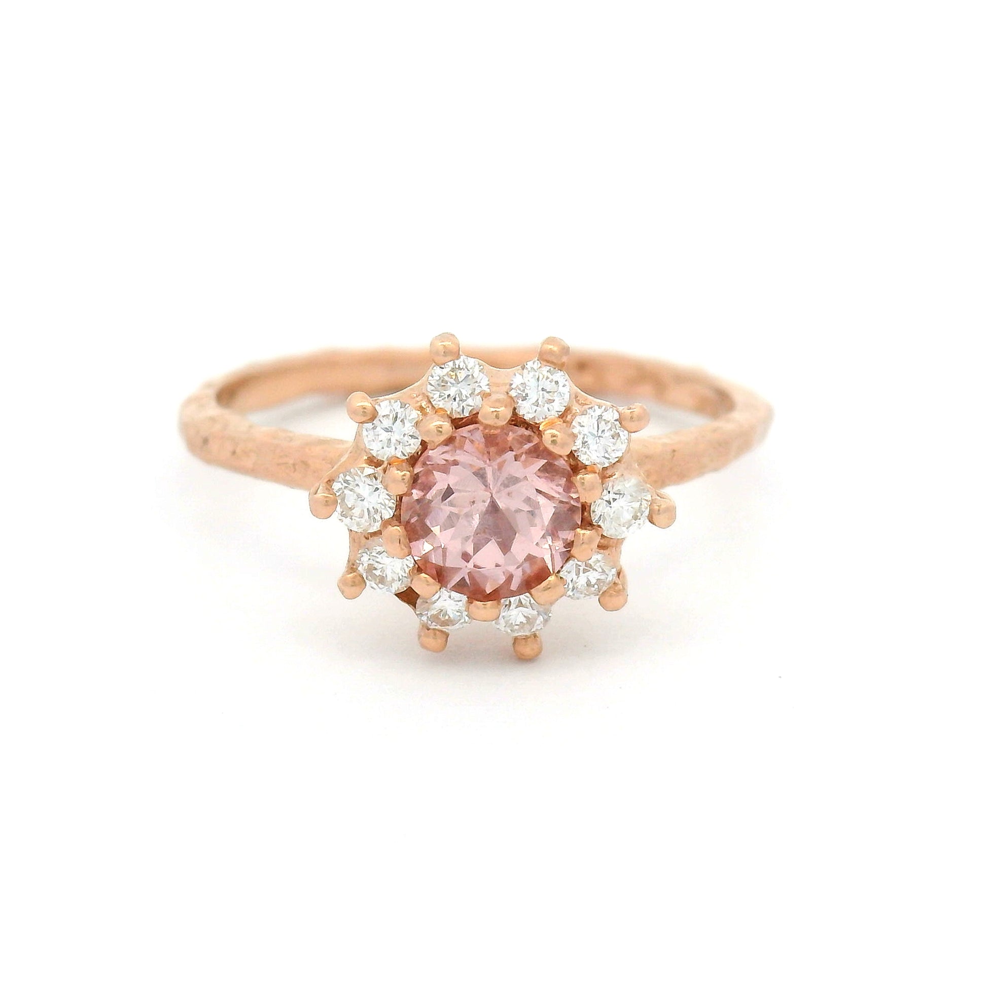 10K rose gold organic textured engagement ring with natural 0.62ct round Tanzanian Malaya garnet and halo of ten natural diamonds totalling 0.21cts.