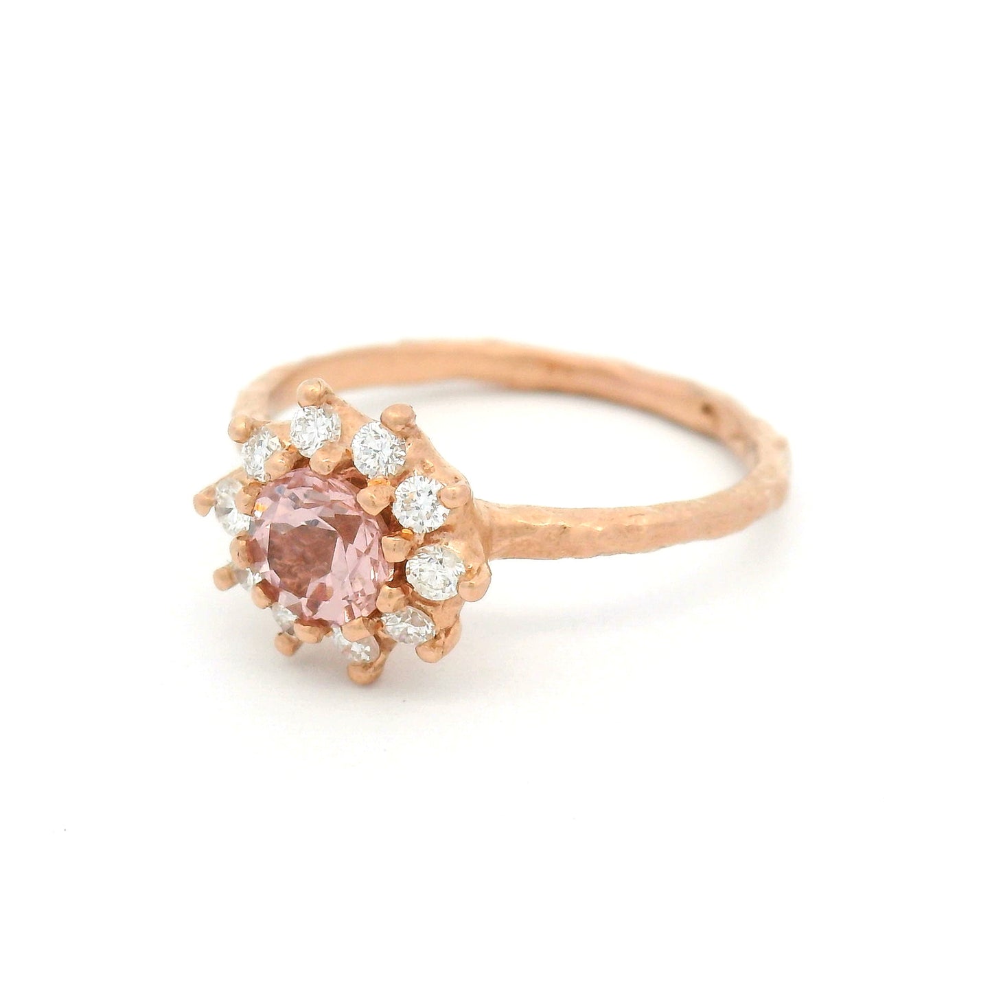 10K rose gold organic textured engagement ring with natural 0.62ct round Tanzanian Malaya garnet and halo of ten natural diamonds totalling 0.21cts.