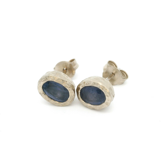 14k white textured organic stud earrings bezel set with oval blue sapphires