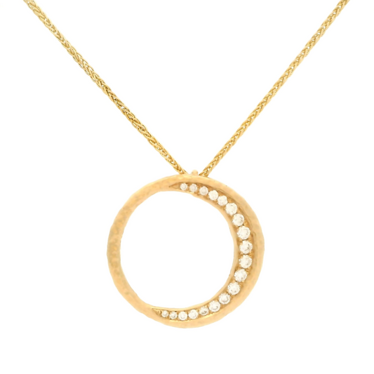 14k yellow organic circle pendant bead set with 0.19cts total weight of diamonds on a chain.