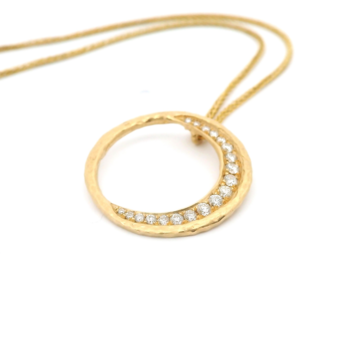 14k yellow organic circle pendant bead set with 0.19cts total weight of diamonds on a chain.