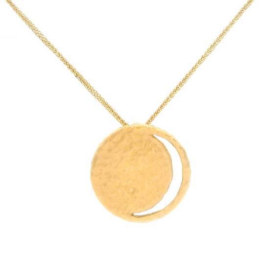 14k yellow organic missing moon disc pendant hanging on a chain.