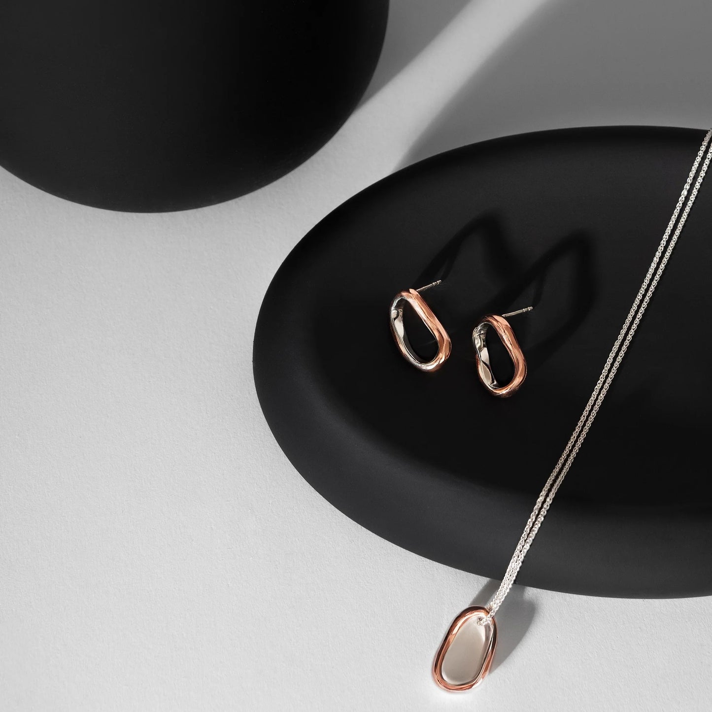 Silver and Copper Curves Pendant