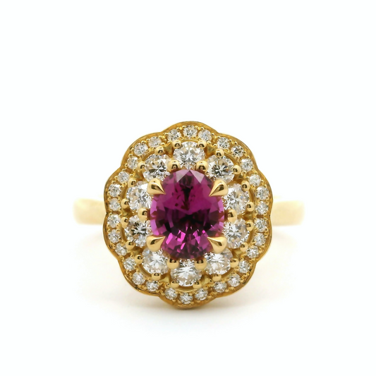18k yellow ring with 1.06ct pink sapphire accented with diamonds.