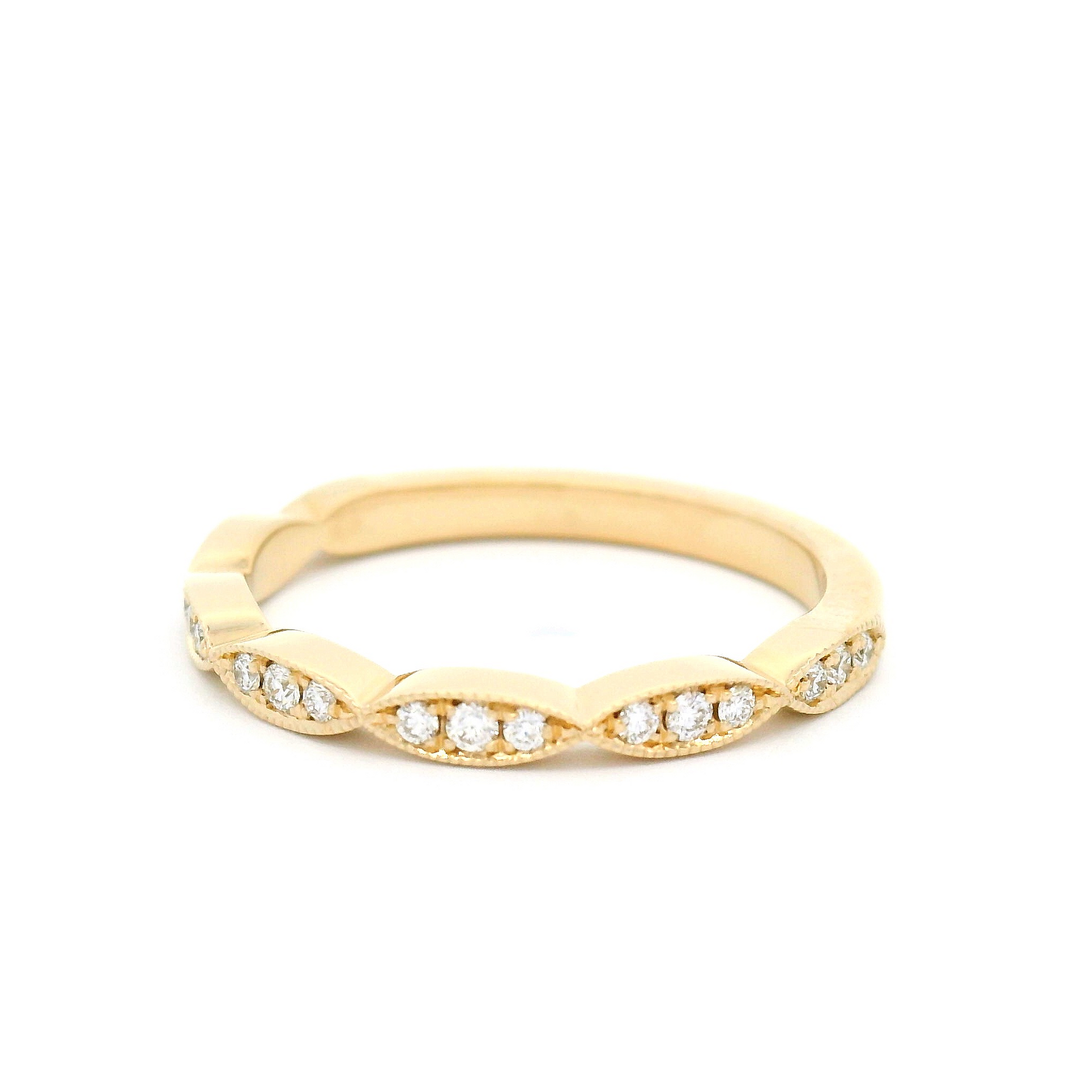 14k yellow ring with 0.16cts total weight of bead set diamonds with milgrain detail.