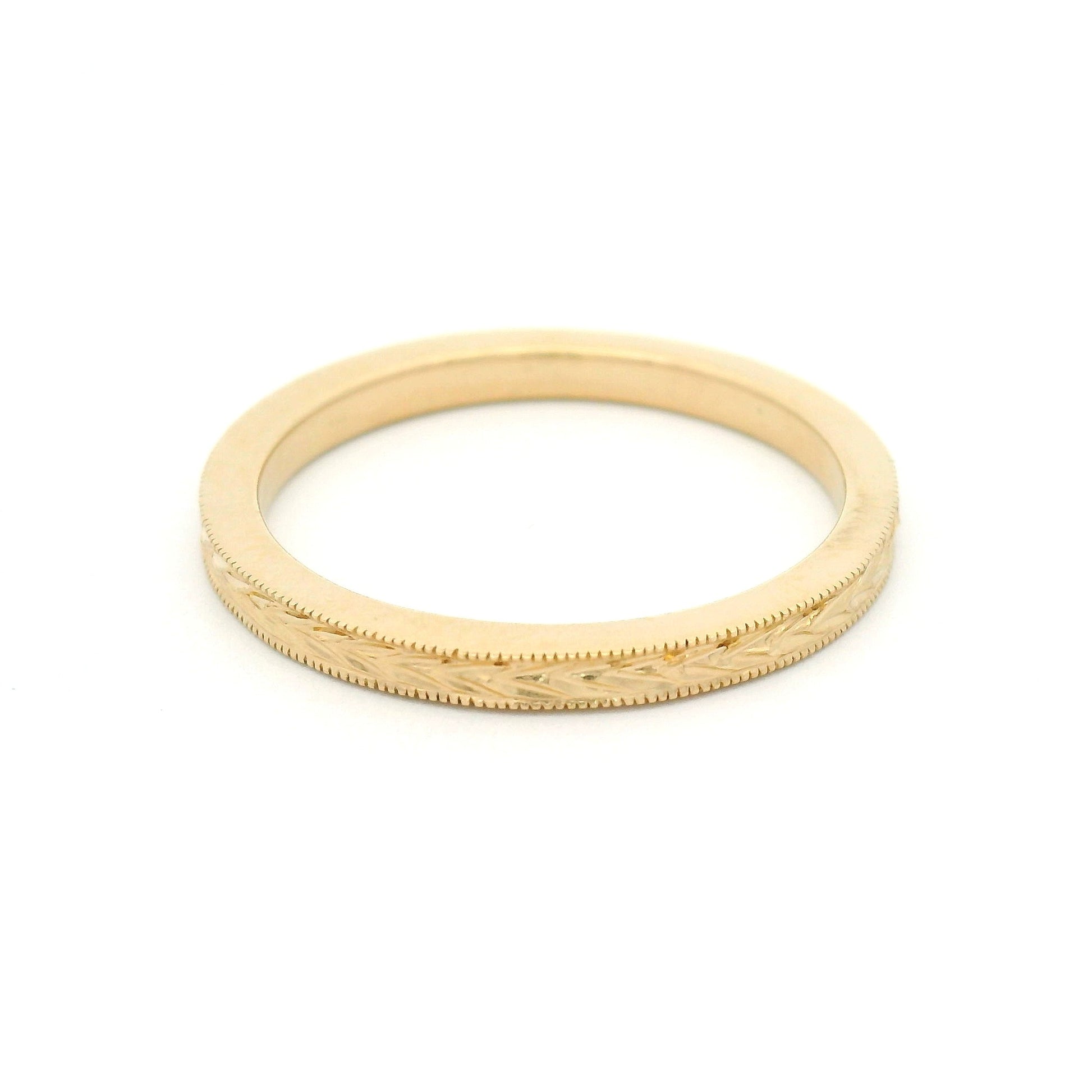 14K yellow gold 2mm flat profile band with hand-engraved wheat sheaf pattern and milgrain edge detailing.