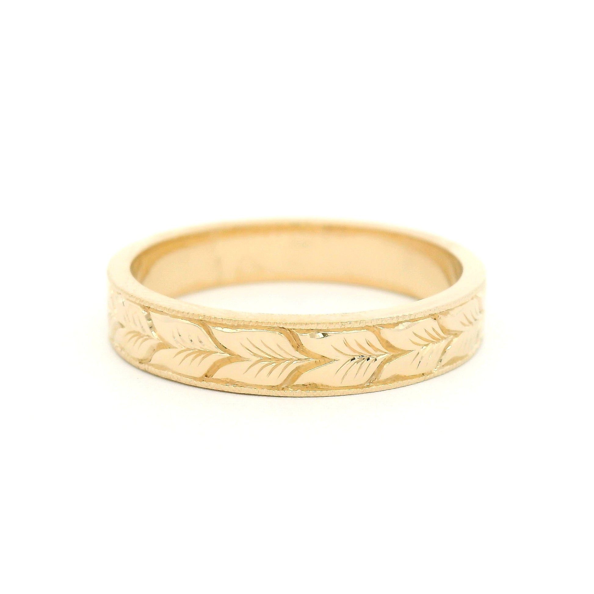 14K yellow gold 4mm flat profile band with hand-engraved aspen leaf pattern and milgrain edge detailing.