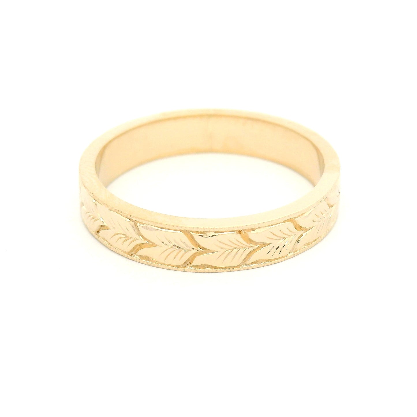 14K yellow gold 4mm flat profile band with hand-engraved aspen leaf pattern and milgrain edge detailing.