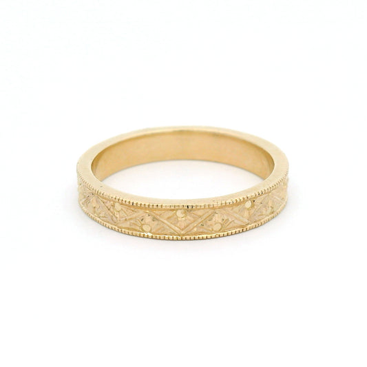 10K yellow gold 3mm flat profile band with engraved Art Deco triangle pattern and detailed sunburst motif