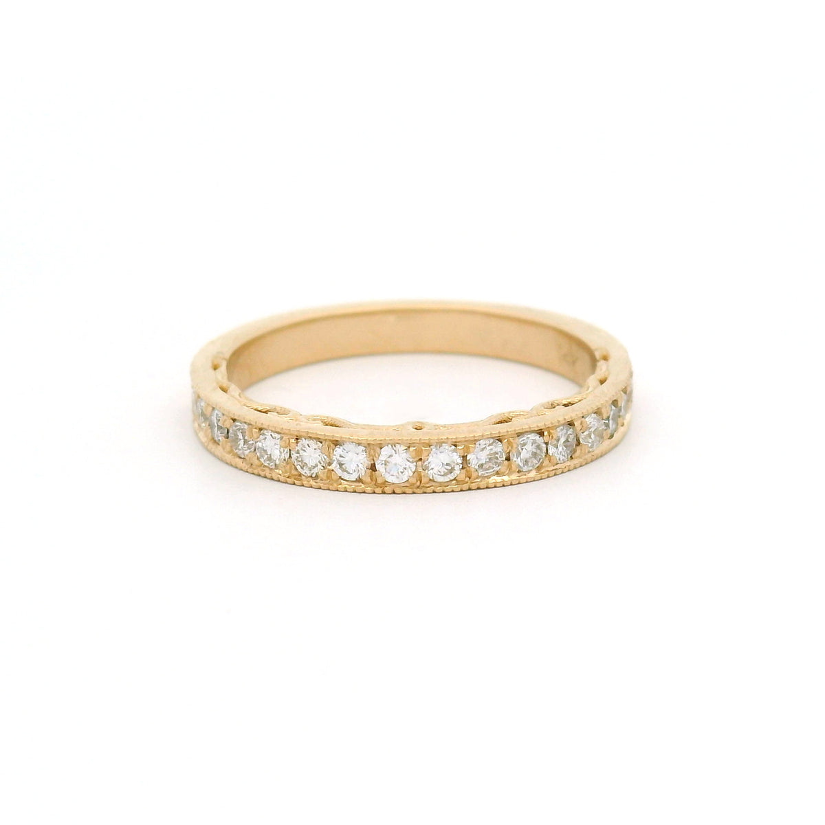 14K yellow gold half eternity wedding and anniversary band featuring 18 bead-set lab-grown round brilliant-cut diamonds totalling 0.33cts, milgrain edges and decorative scrollwork on the sides.
