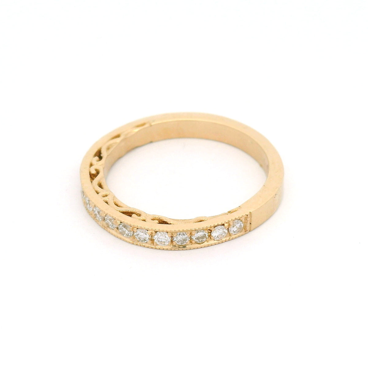 14K yellow gold half eternity wedding and anniversary band featuring 18 bead-set lab-grown round brilliant-cut diamonds totalling 0.33cts, milgrain edges and decorative scrollwork on the sides.
