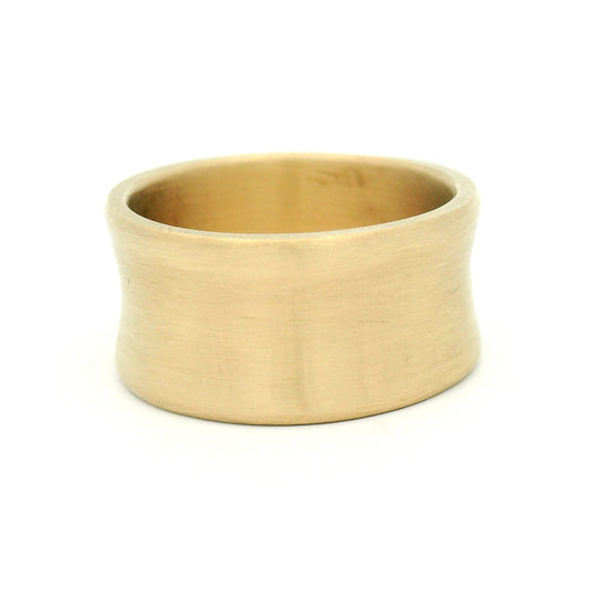 10K yellow gold 10mm wedding band with concave profile and soft satin finish, handcrafted with a modern minimalist design.