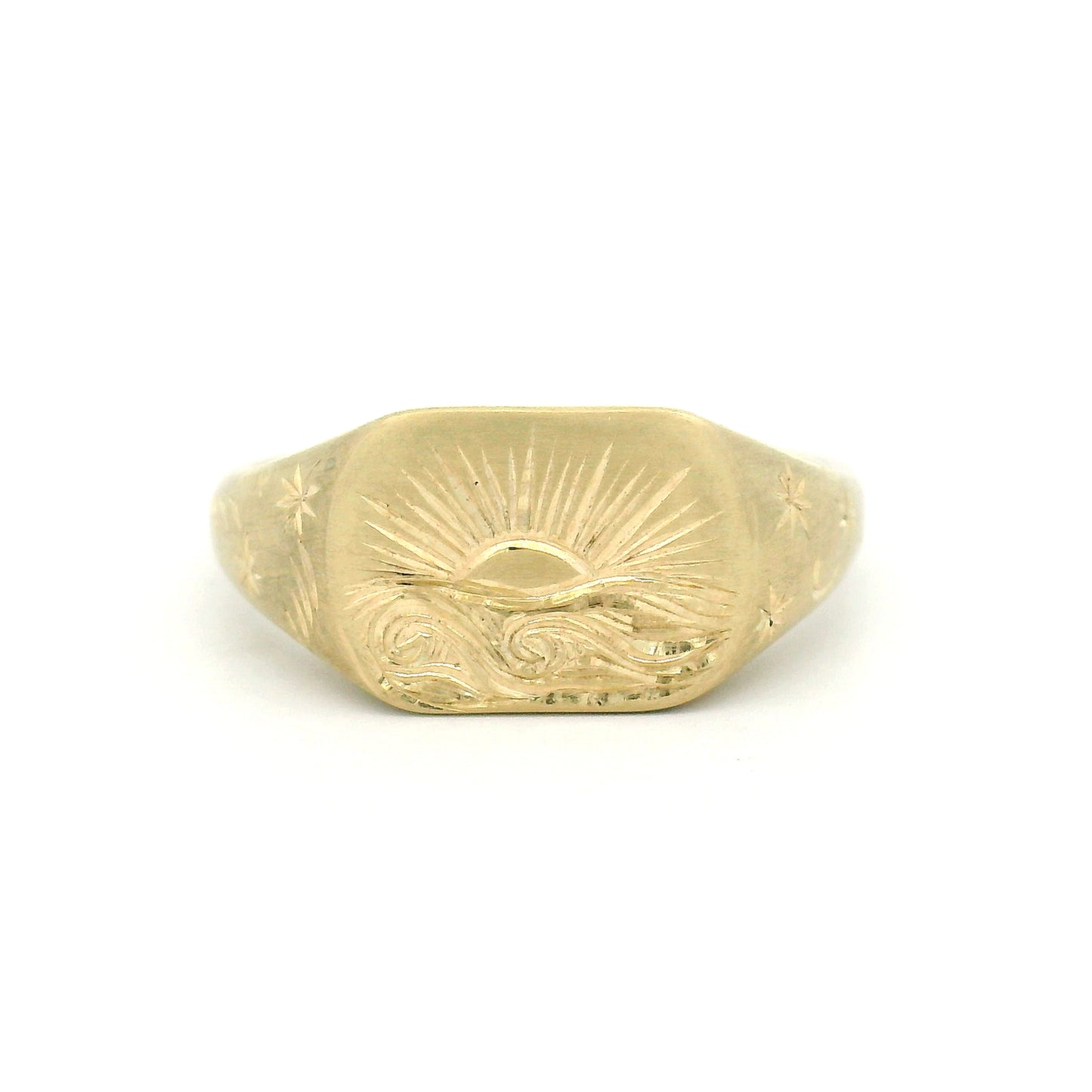 10K yellow gold signet ring with hand-engraved sunset over a wavy sea, star-engraved shoulders, lozenge-shaped 8mm top, and satin finish.
