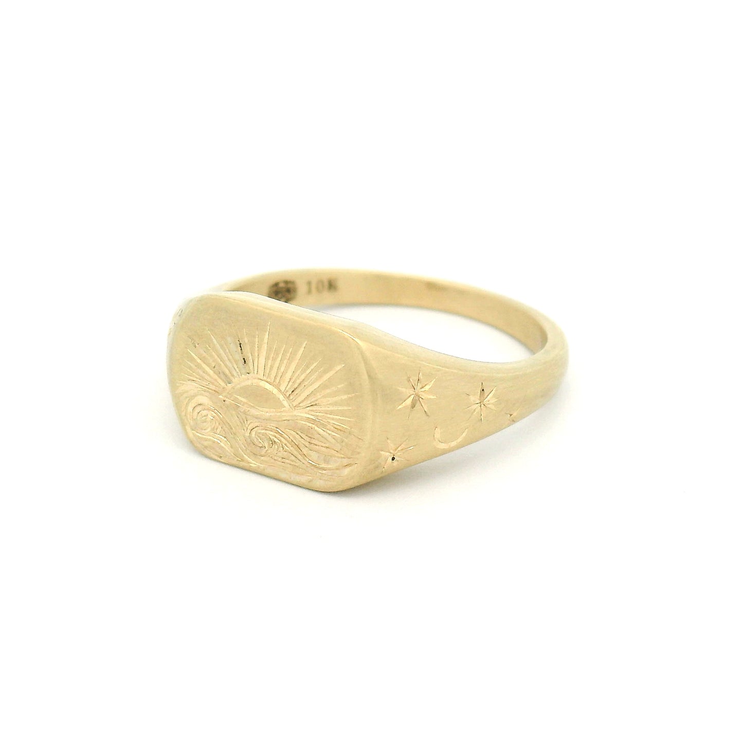 10K yellow gold signet ring with hand-engraved sunset over a wavy sea, star-engraved shoulders, lozenge-shaped 8mm top, and satin finish.